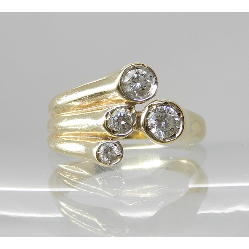 665 - A 9CT GOLD FOUR DIAMOND DRESS RING