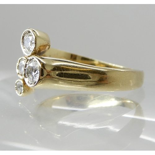 665 - A 9CT GOLD FOUR DIAMOND DRESS RING