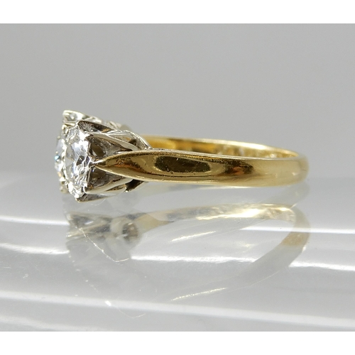 666 - AN 18CT GOLD THREE STONE DIAMOND RING