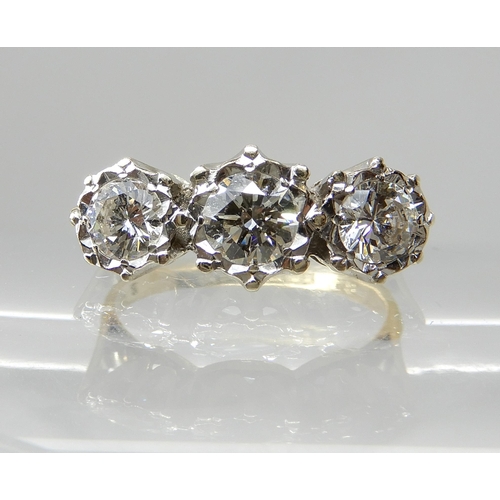 666 - AN 18CT GOLD THREE STONE DIAMOND RING