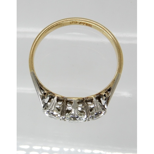 668 - AN 18CT GOLD AND PLATINUM THREE STONE DIAMOND RING