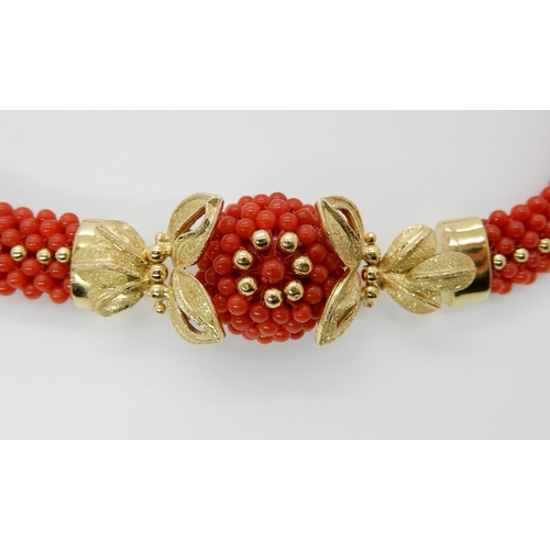 674 - AN 18CT GOLD CORAL NECKLACE AND EARRINGS