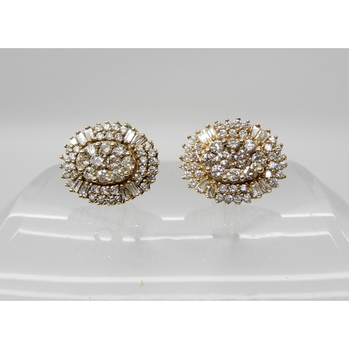 675 - A PAIR OF 14CT GOLD DIAMOND CLUSTER EARRINGS