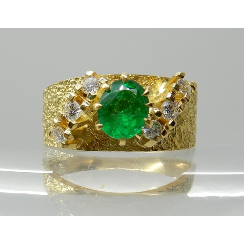 678 - AN 18CT RETRO EMERALD AND DIAMOND RING