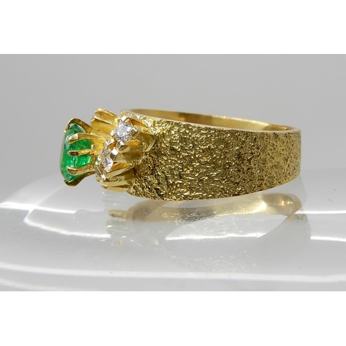 678 - AN 18CT RETRO EMERALD AND DIAMOND RING