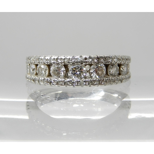 679 - A PLATINUM DIAMOND SET BAND RING