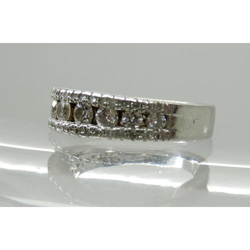 679 - A PLATINUM DIAMOND SET BAND RING