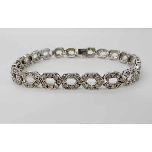 685 - A 9CT WHITE GOLD DIAMOND SET HEXAGONAL LINK BRACELET