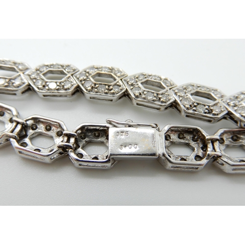 685 - A 9CT WHITE GOLD DIAMOND SET HEXAGONAL LINK BRACELET