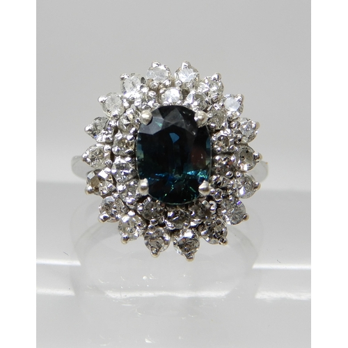 686 - A SAPPHIRE AND DIAMOND CLUSTER RING