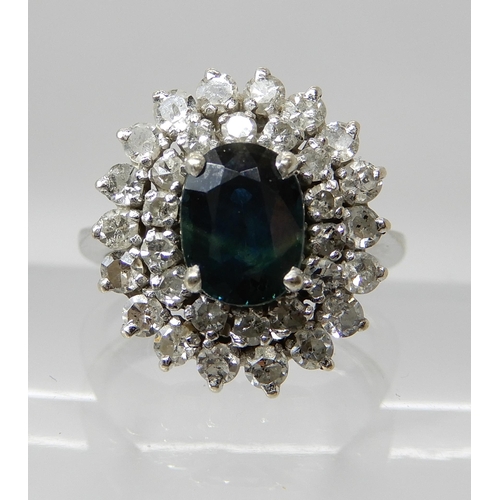 686 - A SAPPHIRE AND DIAMOND CLUSTER RING