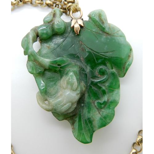 693 - A CHINESE GREEN HARDSTONE PENDANT