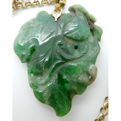 693 - A CHINESE GREEN HARDSTONE PENDANT