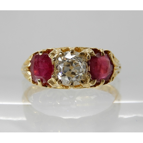 701 - AN 18CT GOLD RUBY AND DIAMOND RING