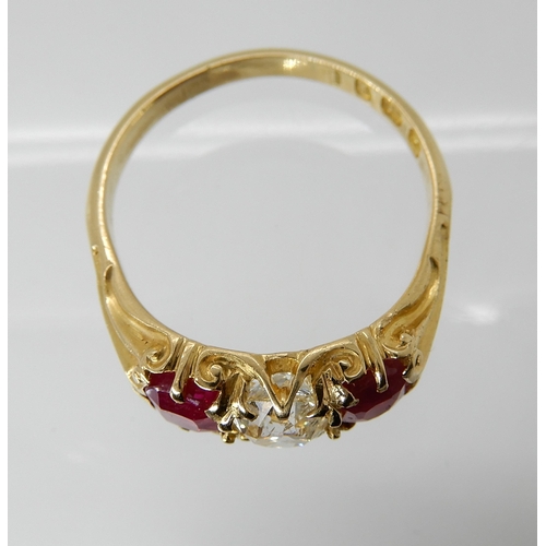 701 - AN 18CT GOLD RUBY AND DIAMOND RING