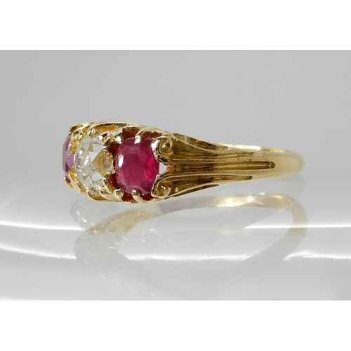 701 - AN 18CT GOLD RUBY AND DIAMOND RING