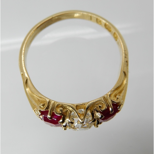 701 - AN 18CT GOLD RUBY AND DIAMOND RING