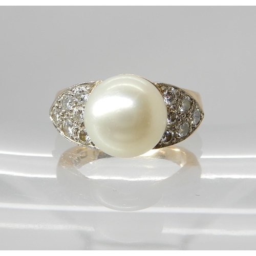 703 - AN 18CT GOLD PEARL AND DIAMOND RING