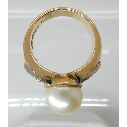 703 - AN 18CT GOLD PEARL AND DIAMOND RING