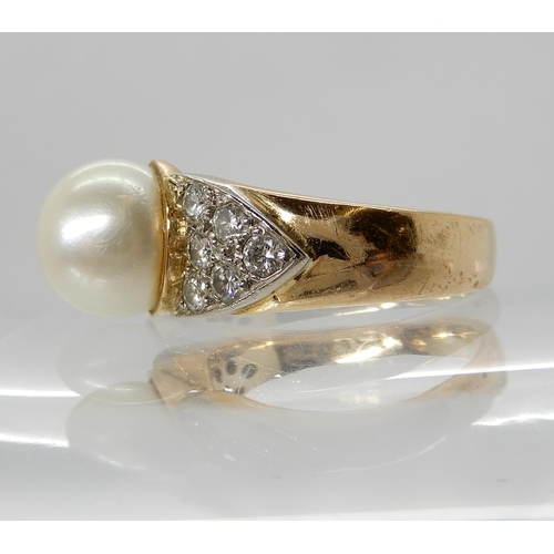 703 - AN 18CT GOLD PEARL AND DIAMOND RING