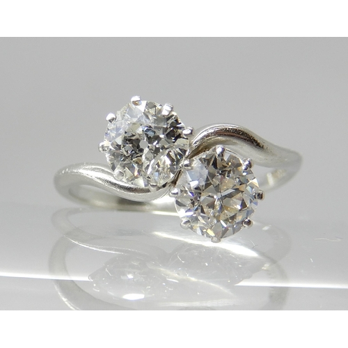 704 - A PLATINUM TWIN STONE DIAMOND RING