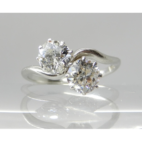 704 - A PLATINUM TWIN STONE DIAMOND RING