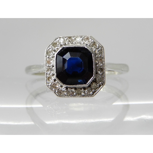 706 - AN 18CT AND PLATINUM DIAMOND AND SAPPHIRE VINTAGE RING