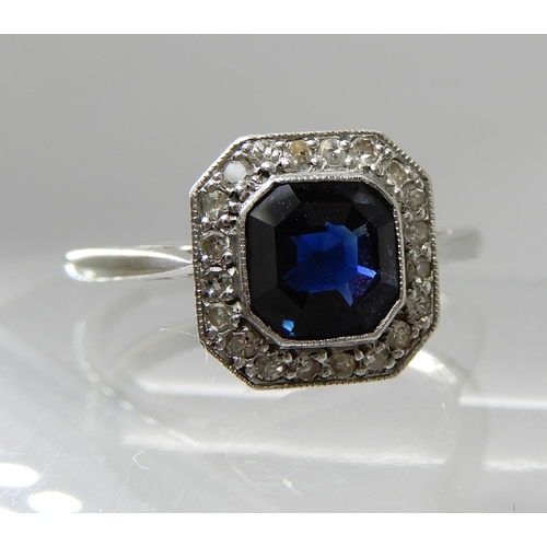 706 - AN 18CT AND PLATINUM DIAMOND AND SAPPHIRE VINTAGE RING