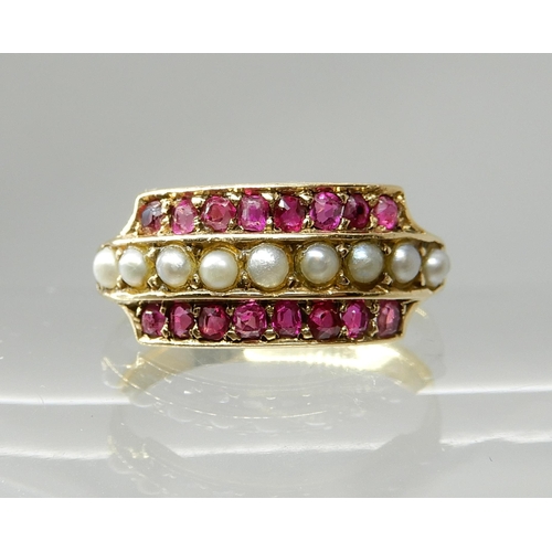 711 - A 15CT GOLD PEARL AND RUBY RING