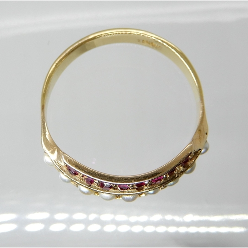 711 - A 15CT GOLD PEARL AND RUBY RING