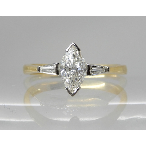 712 - AN 18CT GOLD MARQUIS DIAMOND RING