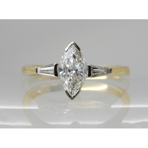 712 - AN 18CT GOLD MARQUIS DIAMOND RING