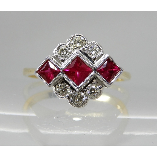 713 - AN 18CT GOLD DIAMOND AND RUBY VINTAGE CLUSTER RING