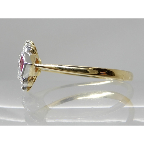 713 - AN 18CT GOLD DIAMOND AND RUBY VINTAGE CLUSTER RING