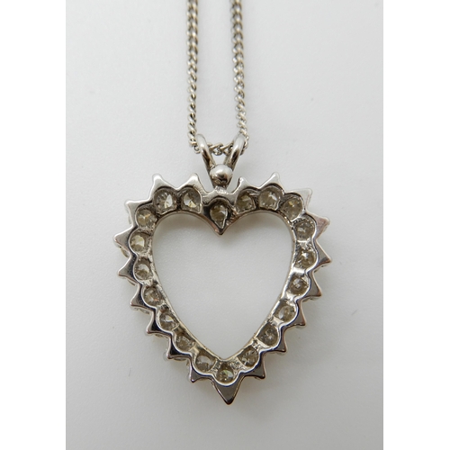 716 - A 14CT WHITE GOLD DIAMOND SET HEART SHAPED PENDANT