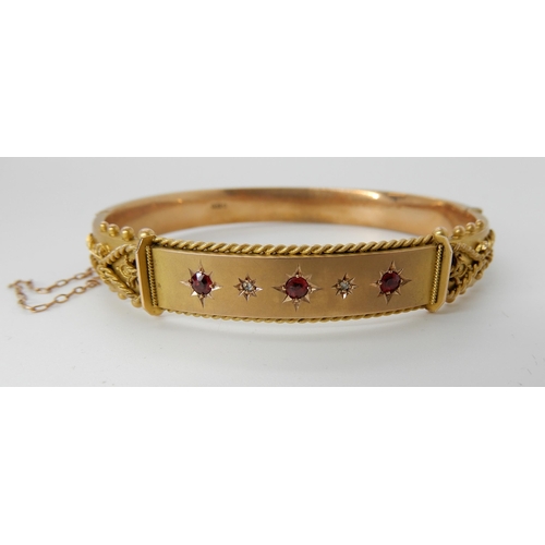 727 - A 9CT GOLD RED GEM AND DIAMOND BANGLE