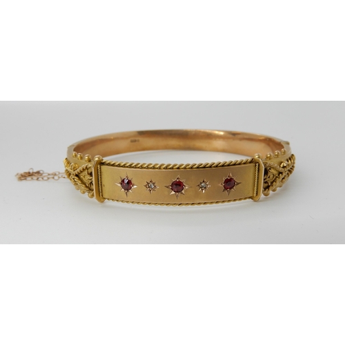 727 - A 9CT GOLD RED GEM AND DIAMOND BANGLE