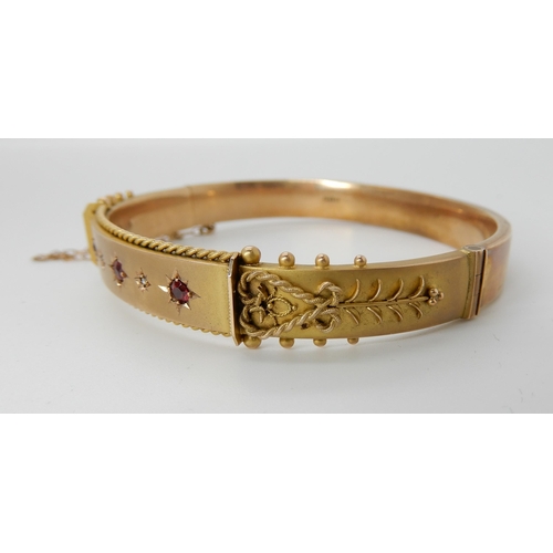 727 - A 9CT GOLD RED GEM AND DIAMOND BANGLE