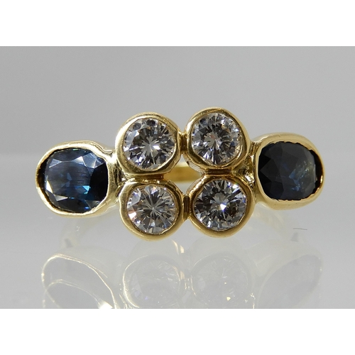 729 - AN 18CT GOLD DIAMOND AND SAPPHIRE RING