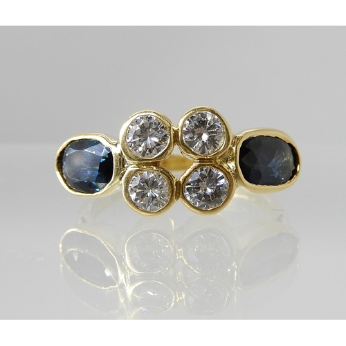 729 - AN 18CT GOLD DIAMOND AND SAPPHIRE RING