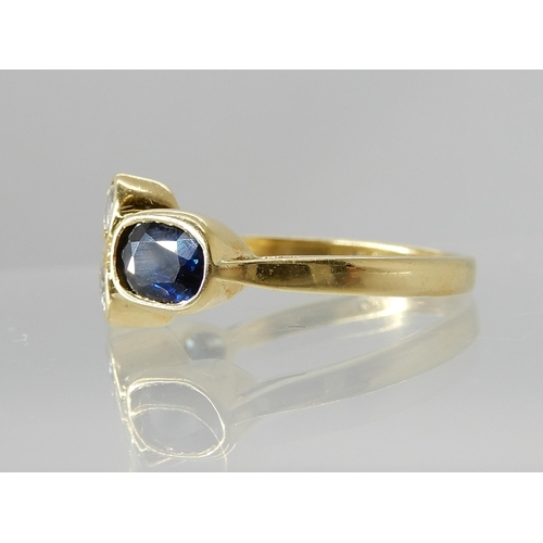 729 - AN 18CT GOLD DIAMOND AND SAPPHIRE RING