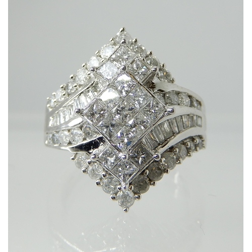 730 - A 9CT WHITE GOLD DIAMOND CLUSTER DRESS RING