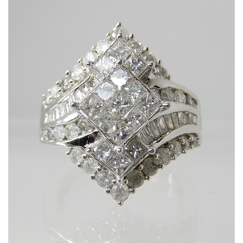 730 - A 9CT WHITE GOLD DIAMOND CLUSTER DRESS RING