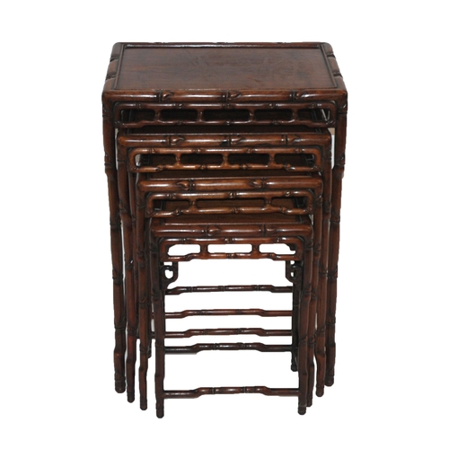 803 - A CHINESE HARDWOOD NEST OF FOUR TABLES