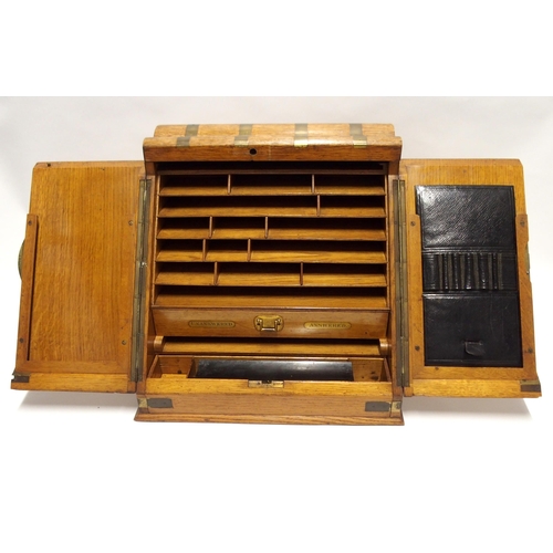 805 - AN ASPREY & SON OAK AND BRASS BOUND STATIONARY CABINET