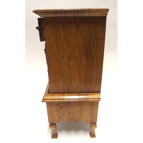 809 - A WILLIAM AND MARY STYLE WALNUT MINIATURE CHEST ON STAND