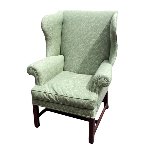 814 - A GEORGIAN STYLE WING BACK ARMCHAIR