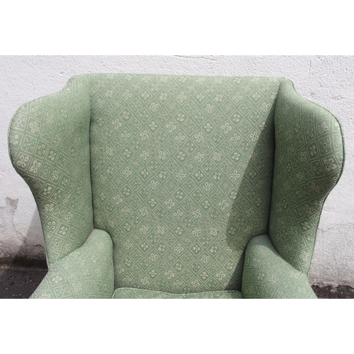 814 - A GEORGIAN STYLE WING BACK ARMCHAIR