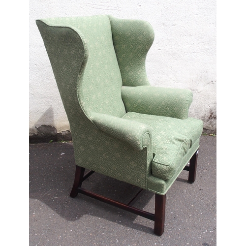 814 - A GEORGIAN STYLE WING BACK ARMCHAIR