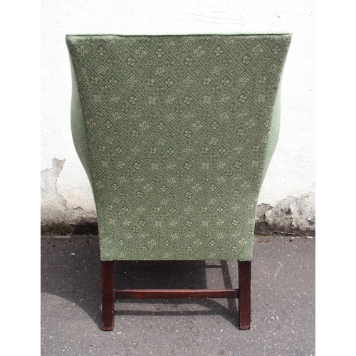 814 - A GEORGIAN STYLE WING BACK ARMCHAIR